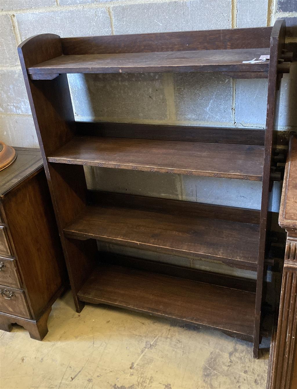 An early 20th century Wylie and Lochead style oak open bookcase, length 95cm, depth 26cm, height 130cm